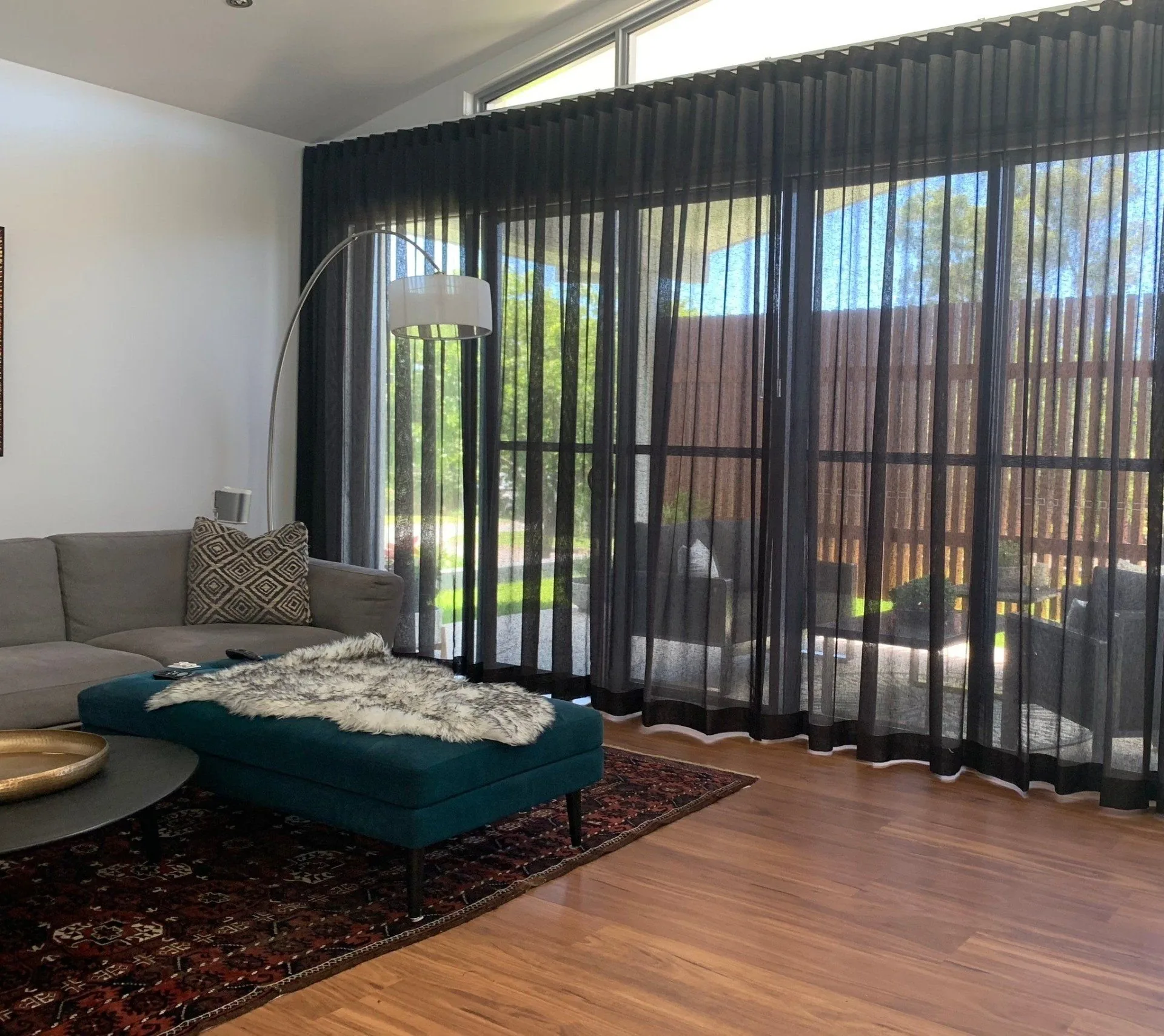 Custom-made curtains fitted wall to wall in a modern Brisbane home