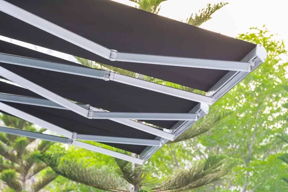 Steel structure outdoor awning against a tree background — awnings in Brisbane